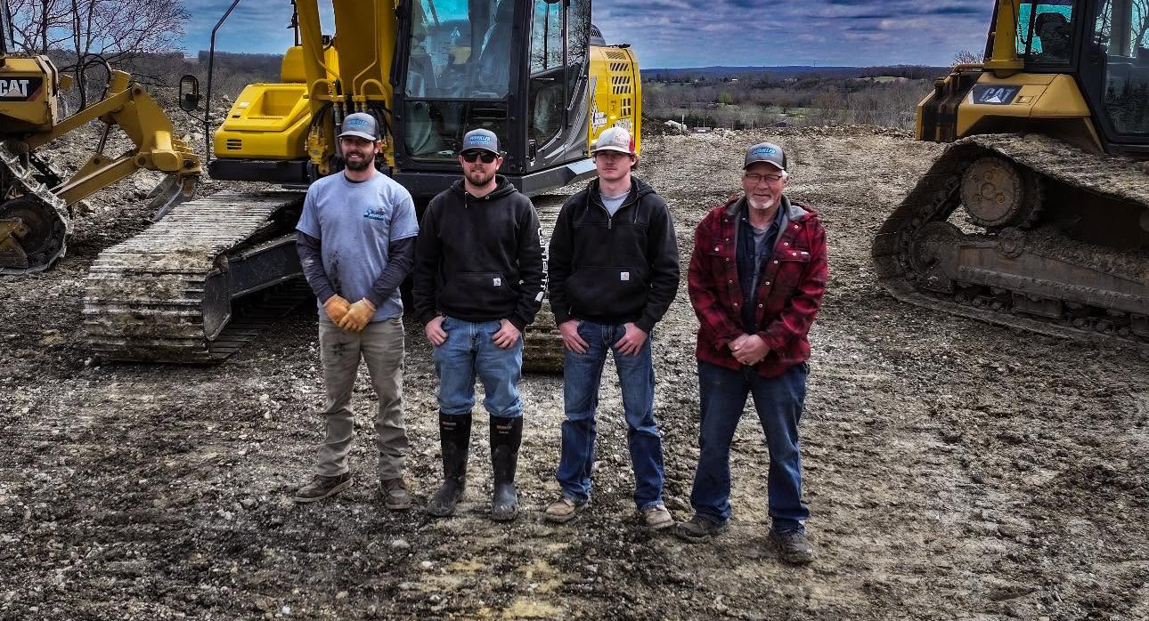Excavation and land management services in Windsor, MO Winkler Land Management excavation crew and heavy equipment on a Henry County, MO job site