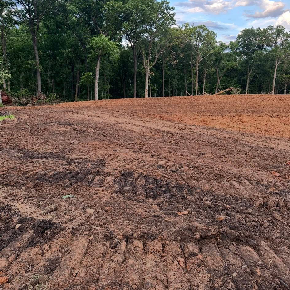 Operator view of site-prep grading through rural fields near Windsor, MO Operator view of site-prep grading through rural fields near Windsor, MO