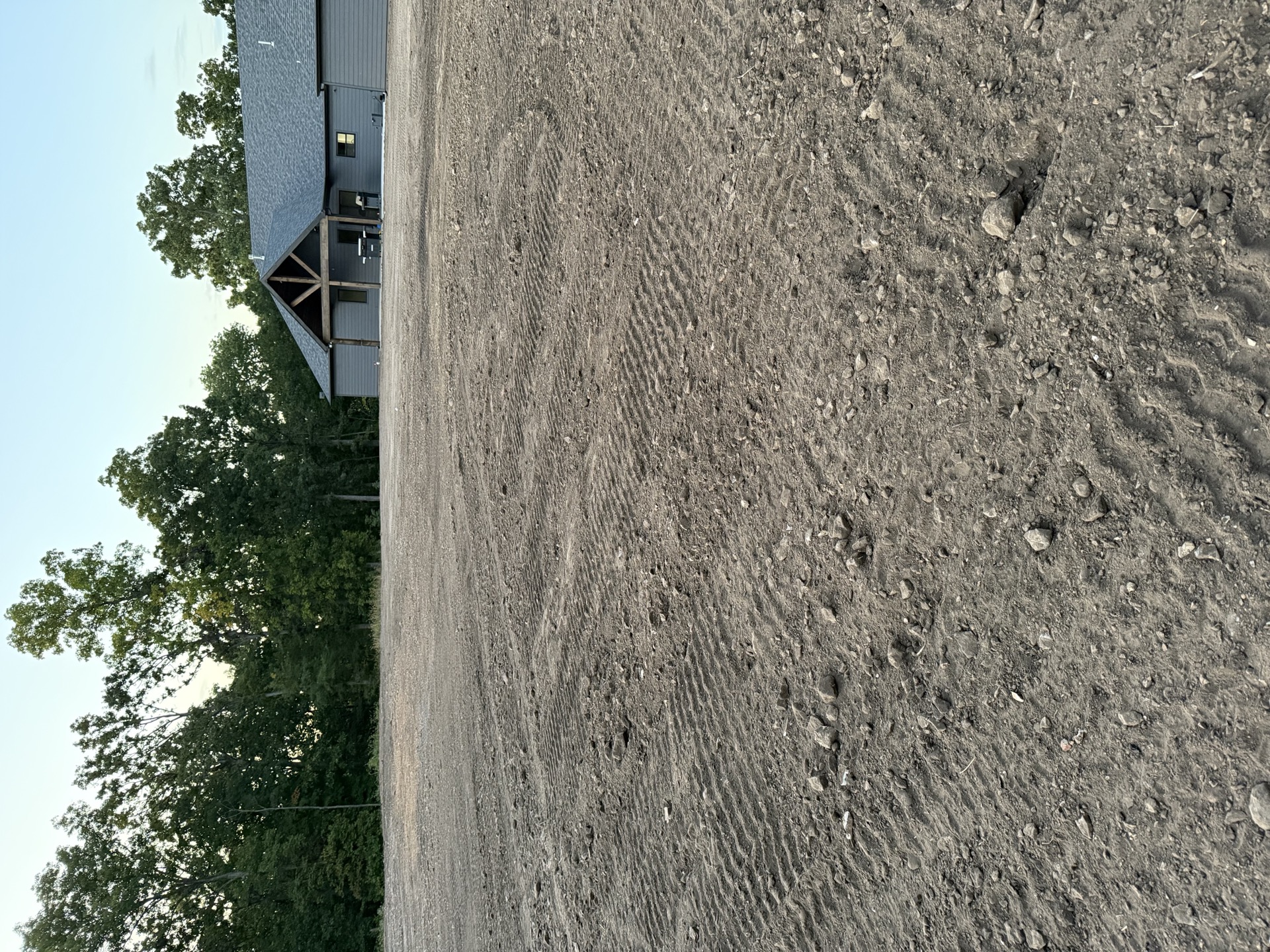 Freshly graded building pad beside a new home near Windsor, MO Freshly graded building pad beside a new home near Windsor, MO