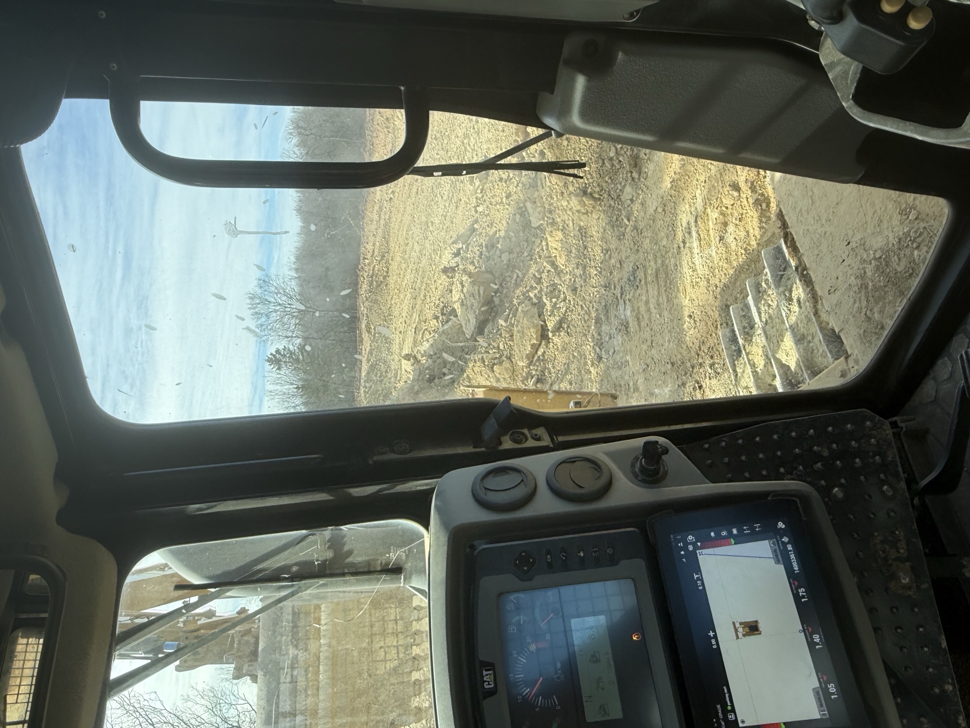 Operator cab view during grading and site-prep near Windsor, MO Operator cab view during grading and site-prep near Windsor, MO